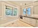 Butler's pantry with white cabinets, quartz countertops, and built-in microwave at 3407 Churchill Rd, Raleigh, NC 27607