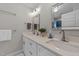 Bright primary bathroom with dual sinks, white cabinetry and modern fixtures at 605 Quarry St, Raleigh, NC 27601