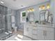 Beautiful bathroom features double sink vanity, modern fixtures, and a glass-enclosed shower at 605 Quarry St, Raleigh, NC 27601