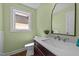 Stylish powder room boasts a modern vanity, quartz countertop and neutral tones at 605 Quarry St, Raleigh, NC 27601
