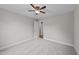 Neutral bedroom is complete with soft carpeting and a ceiling fan at 605 Quarry St, Raleigh, NC 27601