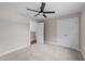 Bedroom featuring a closet, a fan, neutral walls, and a light gray carpet at 605 Quarry St, Raleigh, NC 27601