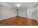 Spacious bedroom featuring gleaming hardwood floors and access to a modern, luxurious bathroom at 605 Quarry St, Raleigh, NC 27601