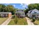 Charming two-story home with a welcoming front porch and well-maintained lawn at 605 Quarry St, Raleigh, NC 27601