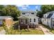 Charming two-story home with a welcoming front porch and well-maintained lawn at 605 Quarry St, Raleigh, NC 27601
