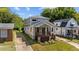 Inviting two-story home showcasing its classic architecture and well-manicured surroundings at 605 Quarry St, Raleigh, NC 27601