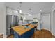 Beautiful kitchen with white cabinets, stainless appliances, and butcher block island at 605 Quarry St, Raleigh, NC 27601