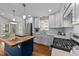 Modern kitchen with white cabinets, stainless appliances, and butcher block island at 605 Quarry St, Raleigh, NC 27601