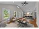 Open concept living area with dining space, hardwood floors, and neutral paint at 605 Quarry St, Raleigh, NC 27601