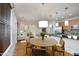 Bright dining area with a round table and chairs, adjacent to the kitchen and living room at 700 Finsbury St # 306, Durham, NC 27703