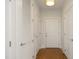 Clean hallway with hardwood floors and neutral walls at 700 Finsbury St # 306, Durham, NC 27703