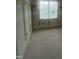 Unfinished room with wood trim and large window at 217 Dublin Rd, Raleigh, NC 27609