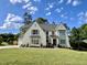 Elegant two-story home with lush lawn, manicured landscaping, and a welcoming facade at 217 Dublin Rd, Raleigh, NC 27609