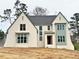 Beautiful new construction home featuring a painted brick facade and modern window trim detail at 217 Dublin Rd, Raleigh, NC 27609