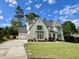 Attractive two-story home with well-maintained lawn, attached garage, and inviting curb appeal at 217 Dublin Rd, Raleigh, NC 27609