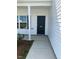 Close up of front door with number 253 and white columns at 253 Plains Dr # 264, Burlington, NC 27217