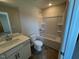 Bathroom featuring a tub/shower combo and single sink vanity at 120 Wild Turkey Way, Lillington, NC 27546