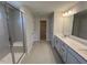 Bathroom featuring a shower, dual sink vanity and closet at 120 Wild Turkey Way, Lillington, NC 27546