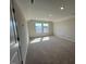 Bright, spacious bedroom with carpeted floors and two windows offering ample natural light at 120 Wild Turkey Way, Lillington, NC 27546
