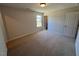 Large bedroom featuring a window and neutral color palette at 120 Wild Turkey Way, Lillington, NC 27546
