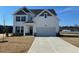 Beautiful two-story home with a classic white exterior and well-manicured lawn at 120 Wild Turkey Way, Lillington, NC 27546