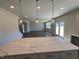Modern kitchen with granite countertops and stainless steel appliances at 120 Wild Turkey Way, Lillington, NC 27546