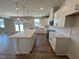 Stylish kitchen featuring stainless steel appliances and a central island at 120 Wild Turkey Way, Lillington, NC 27546