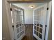 Bright office space with elegant glass French doors and hardwood flooring at 120 Wild Turkey Way, Lillington, NC 27546