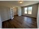 Spacious home office with natural light, hardwood floors, and double glass doors at 120 Wild Turkey Way, Lillington, NC 27546
