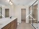 Modern bathroom with double vanity, walk-in shower, and closet at 211 Wild Turkey Way, Lillington, NC 27546
