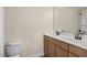 Bathroom features a double vanity, a large mirror, and a toilet at 211 Wild Turkey Way, Lillington, NC 27546