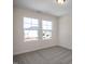 Bright bedroom with carpet flooring and two large windows offering natural light at 211 Wild Turkey Way, Lillington, NC 27546