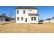 Two-story house with white siding, backyard, and a patio at 211 Wild Turkey Way, Lillington, NC 27546