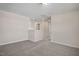 Upstairs hallway with carpeted flooring and access to bedrooms at 211 Wild Turkey Way, Lillington, NC 27546