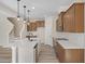 Kitchen with light wood cabinets and white quartz countertops at 211 Wild Turkey Way, Lillington, NC 27546