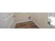 Laundry area with wood-look flooring and built-in utility access at 211 Wild Turkey Way, Lillington, NC 27546