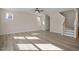 Bright living room featuring hardwood floors and a staircase at 211 Wild Turkey Way, Lillington, NC 27546