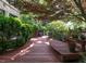 Inviting wooden deck surrounded by lush greenery, offering a serene outdoor space for relaxation at 2501 Kenmore Dr, Raleigh, NC 27608