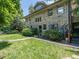 Charming stone home with lush landscaping and a well-manicured lawn adds to its curb appeal at 2501 Kenmore Dr, Raleigh, NC 27608