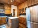 Spacious kitchen featuring hardwood floors, wooden cabinets, and stainless steel appliances at 2501 Kenmore Dr, Raleigh, NC 27608