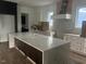 Large kitchen island with white quartz countertops at 604 Edmund St, Raleigh, NC 27604