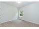 Neutral bedroom with a window that allows natural light to illuminate the space at 67 Decatur Dr, Fuquay Varina, NC 27526