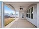 Covered back porch perfect for outdoor dining, with a ceiling fan and views of the backyard at 3113 Petrea Ct # 38, Angier, NC 27501