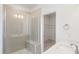 Bathroom featuring a glass-enclosed shower, linen closet and bright white quartz countertops at 3113 Petrea Ct # 38, Angier, NC 27501
