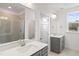 Elegant bathroom with double sinks, gray cabinets, modern fixtures, and a glass enclosed shower at 3113 Petrea Ct # 38, Angier, NC 27501