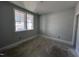 Unfinished bedroom with neutral wall color and two windows allowing natural light to illuminate the room at 3113 Petrea Ct # 38, Angier, NC 27501