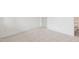 Bright bedroom features neutral carpeting, white trim, and a door to the en-suite bathroom at 3113 Petrea Ct # 38, Angier, NC 27501