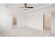 Bright, airy primary bedroom with a ceiling fan and doorways to the ensuite and closets at 3113 Petrea Ct # 38, Angier, NC 27501