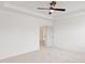 Bright, airy primary bedroom with a ceiling fan and doorways to the ensuite and closets at 3113 Petrea Ct # 38, Angier, NC 27501