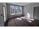 Unfinished bedroom with neutral wall color, three windows allowing natural light and an outdoor view at 3113 Petrea Ct # 38, Angier, NC 27501
